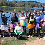 a group of people wearing tutus went to dragon boating